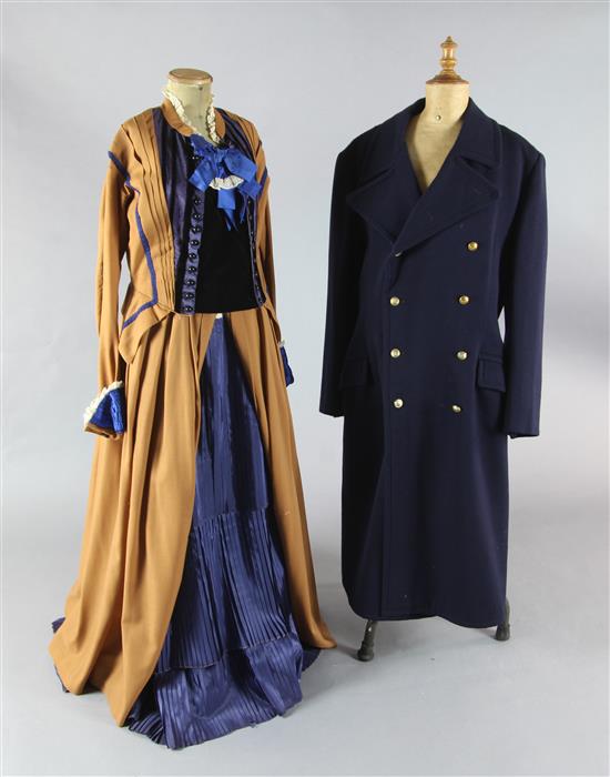 Die Fledermaus: A rail with a pink and white lace shirt and bodice, a similar two piece in lilac, various black and gold